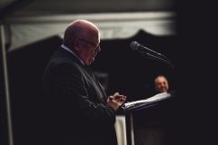 Ed Kerns speaks at the podium during  the Karl Stirner Arts Trail gala.