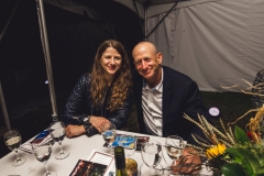 A man and woman smile for a photo at the Karl Stirner Arts Trail gala.