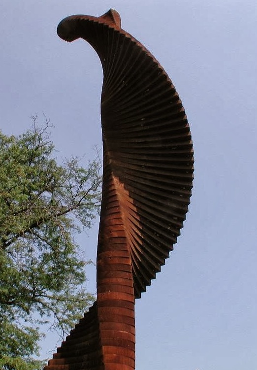 Easton Ellipse by Patricia Meyerowitz on the Karl Stirner Arts Trail in Easton, Pennsylvania, is comprised of large horizontal pieces of redwood in winding curves 