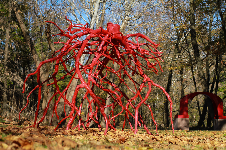 The red sculpture Late Bronze Root by Steve Tobin, reassembled castings of the delicate root system of a tree, on the Karl Stirner Arts Trail in Easton, Pennsylvania