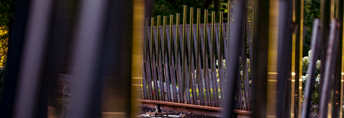 A portion of the vertical rods comprising the Musical Path installation on the Karl Stirner Arts Trail in Easton, Pennsylvania.