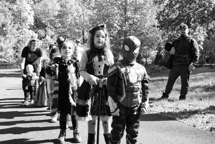 Children dressed in costumes stand on the walking trail during the Come as You Art parade on the Karl Stirner Arts Trail in Easton, Pennsylvania.