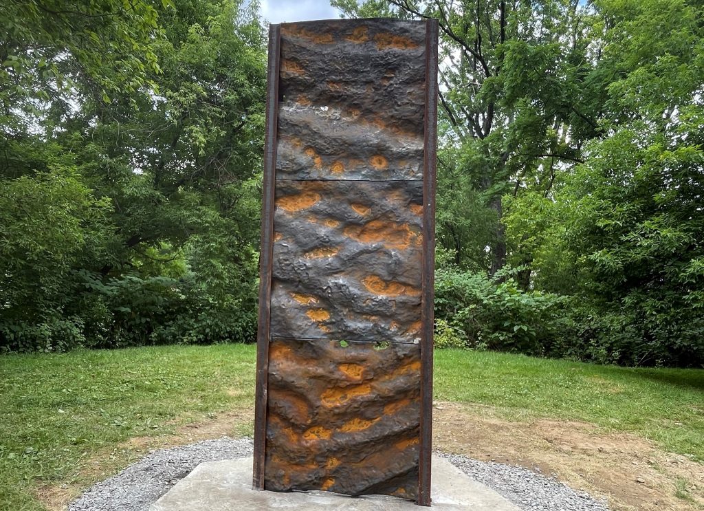 Made of iron, rocks, and steel, the sculpture called Upriver: Ripple Marks by Heidi Wiren Bartlett stands on the Karl Stirner Arts Trail in Easton, Pennsylvania.
