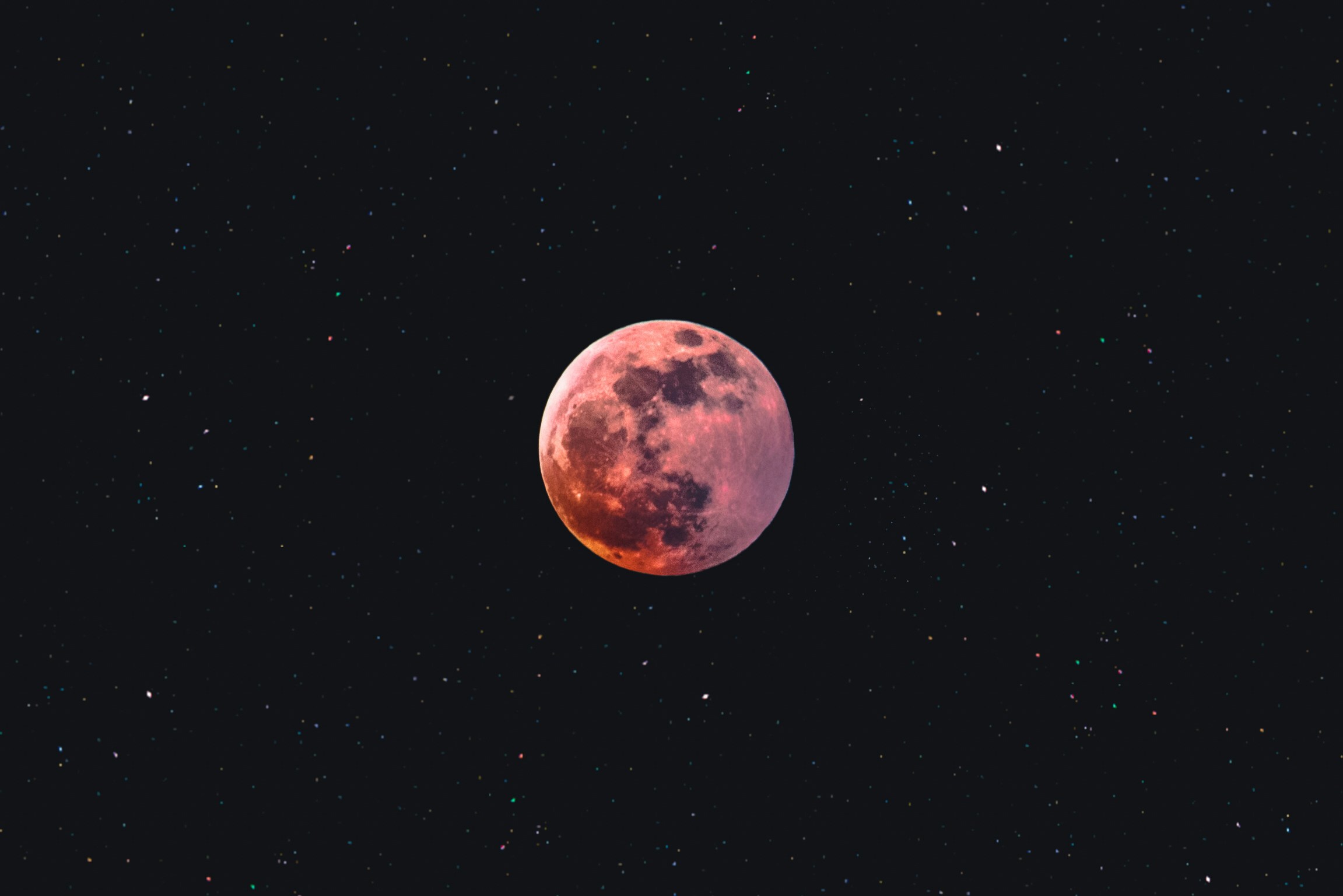 Strawberry moon A pink moon and outer space with stars in the background